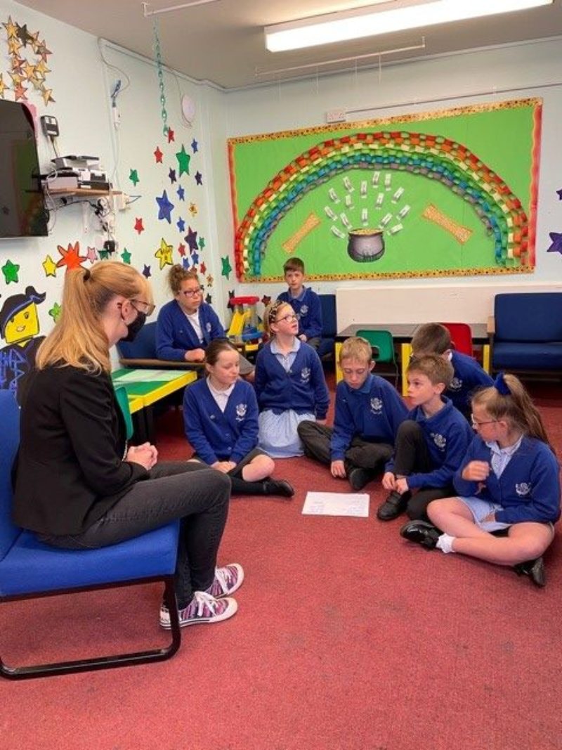 Some of the children talking to Cat about the importance of recycling