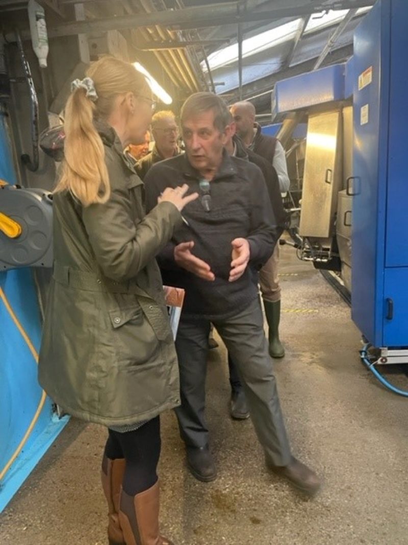 Cat meets members of the farming community